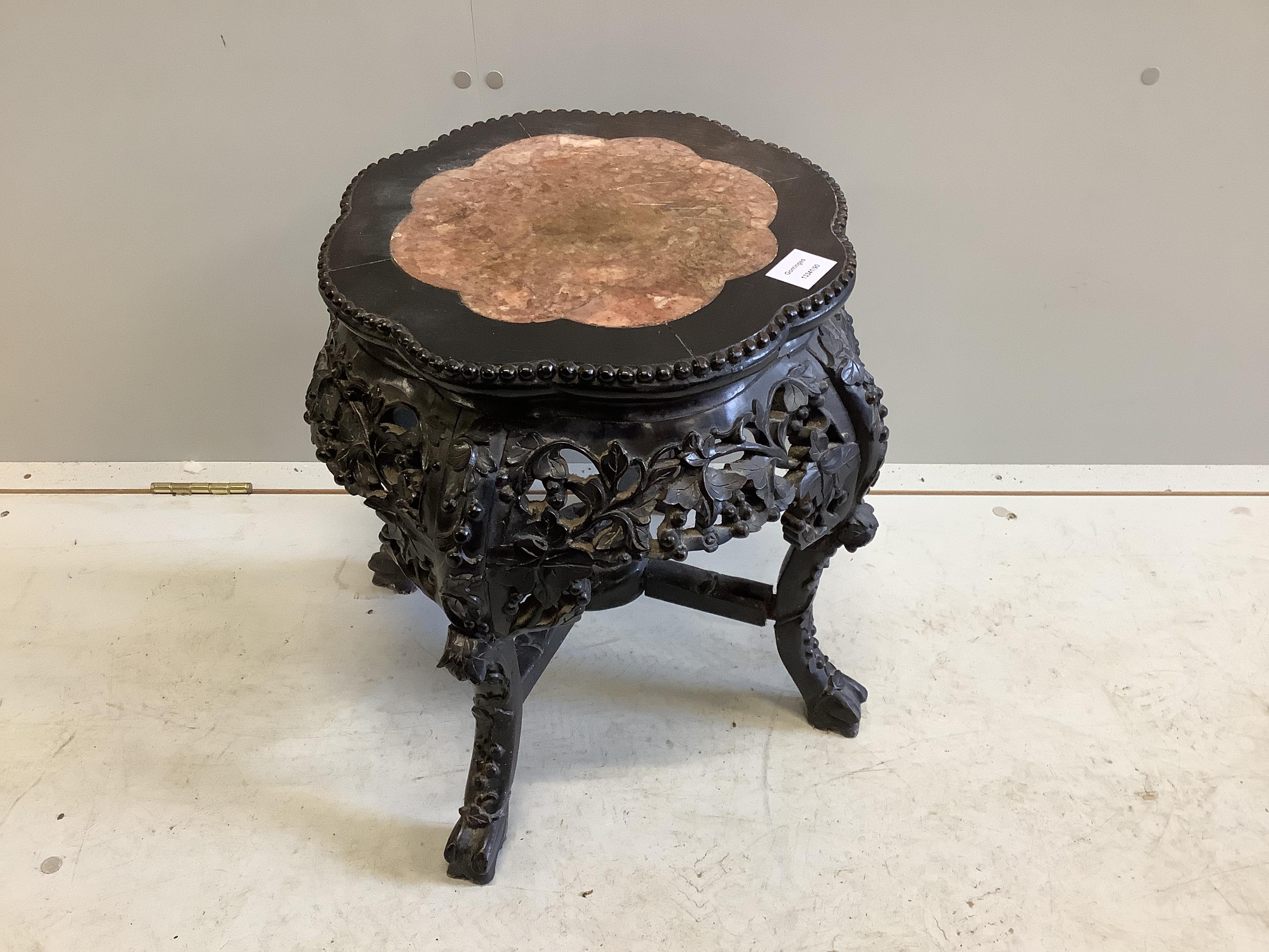 A Chinese circular hardwood rouge marble topped jardiniere stand, diameter 42cm, height 47cm